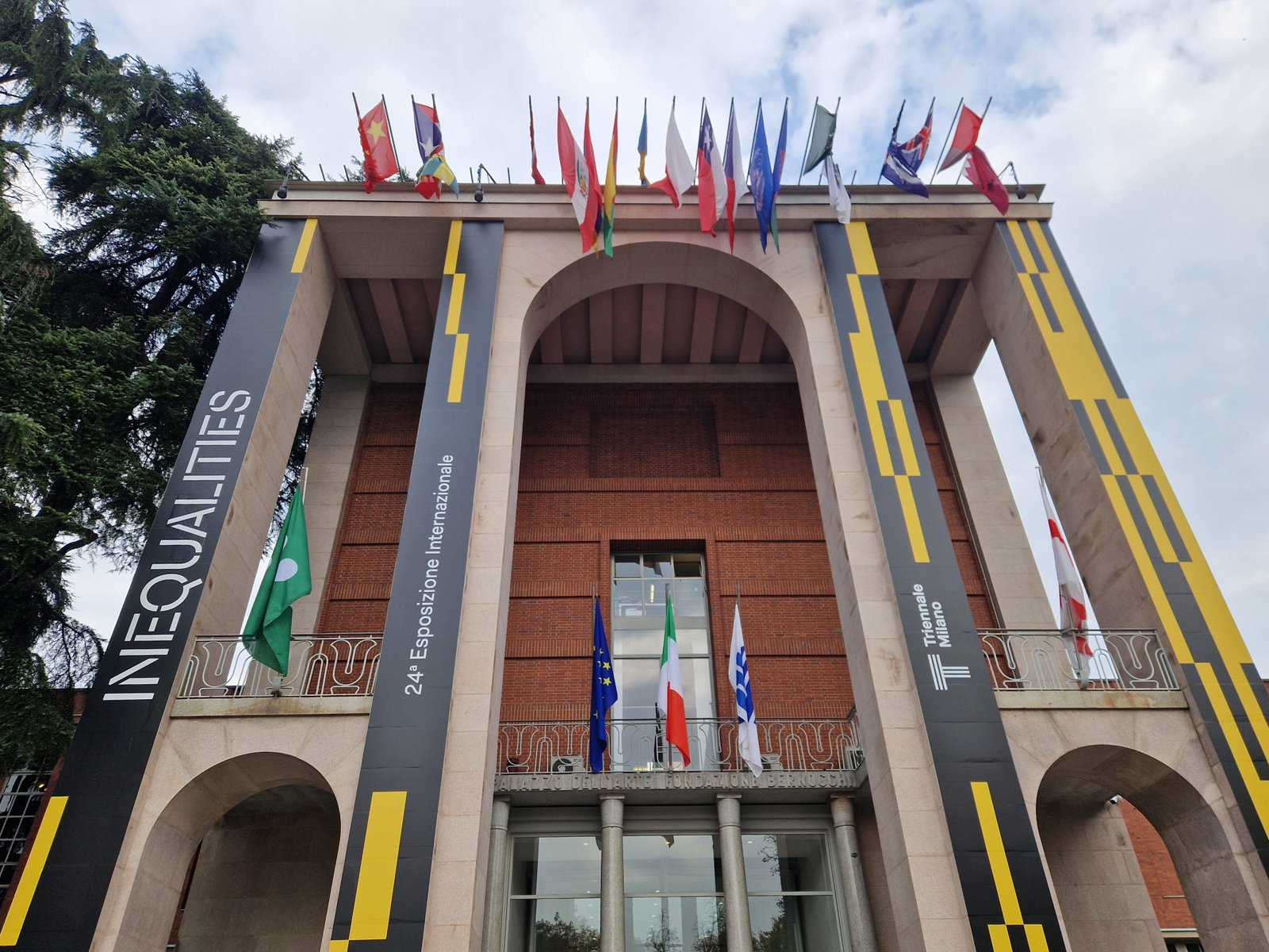 The brick facade of Palazzo dell Arte by Giovanni Muzio facing Parco Sempione in Milan
