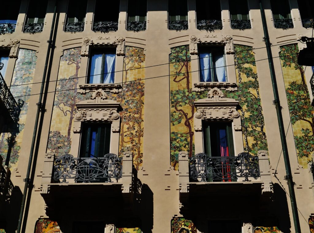 The painted ceramic-tiled facade of Casa Galimberti, Milan