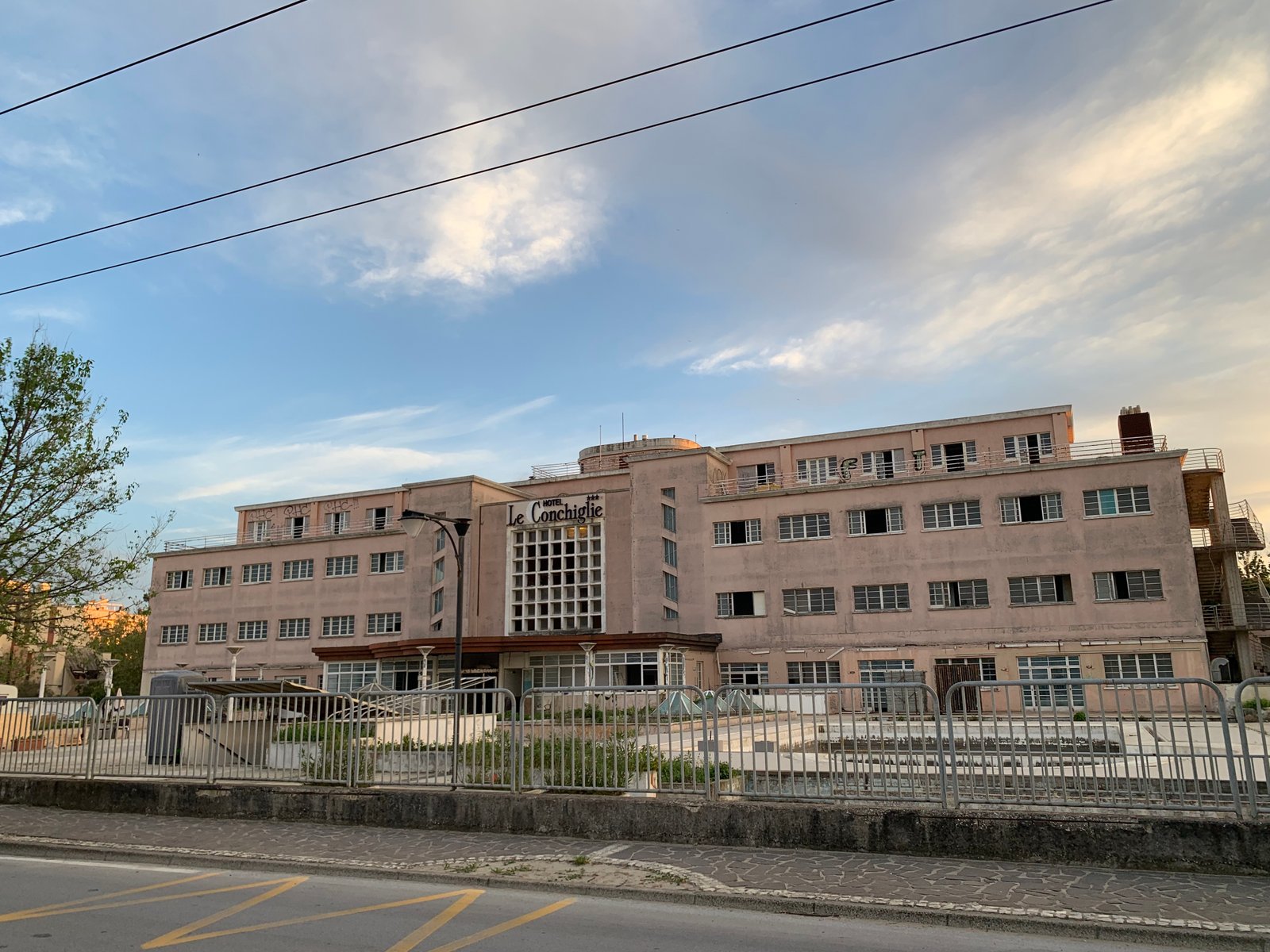 The former Colonia Dalmine seaside complex in Riccione, now Hotel Le Conchiglie, photographed from the beach side in 2024.