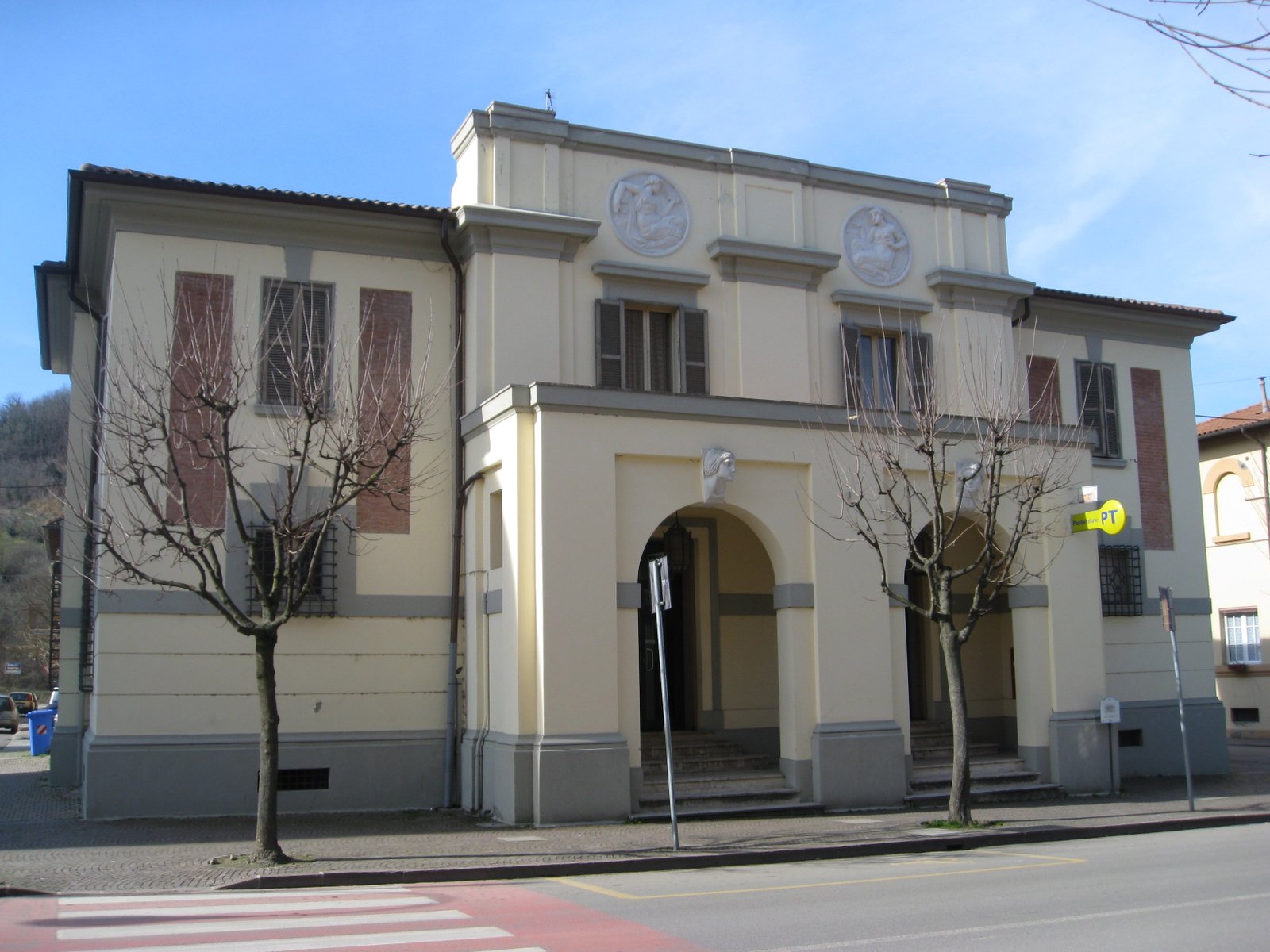 Facade of the Palazzo delle Poste in Predappio, with its arcaded portico facing Piazza Sant'Antonio