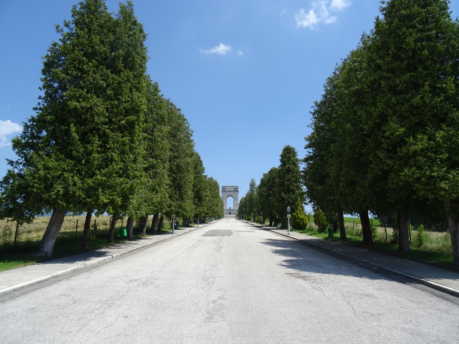 The quadrifrons triumphal arch of the Asiago Military Memorial in white marble on Colle del Leiten